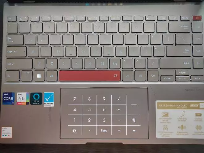 The keyboard with the virtual NumberPad lit up where the touchpad is.